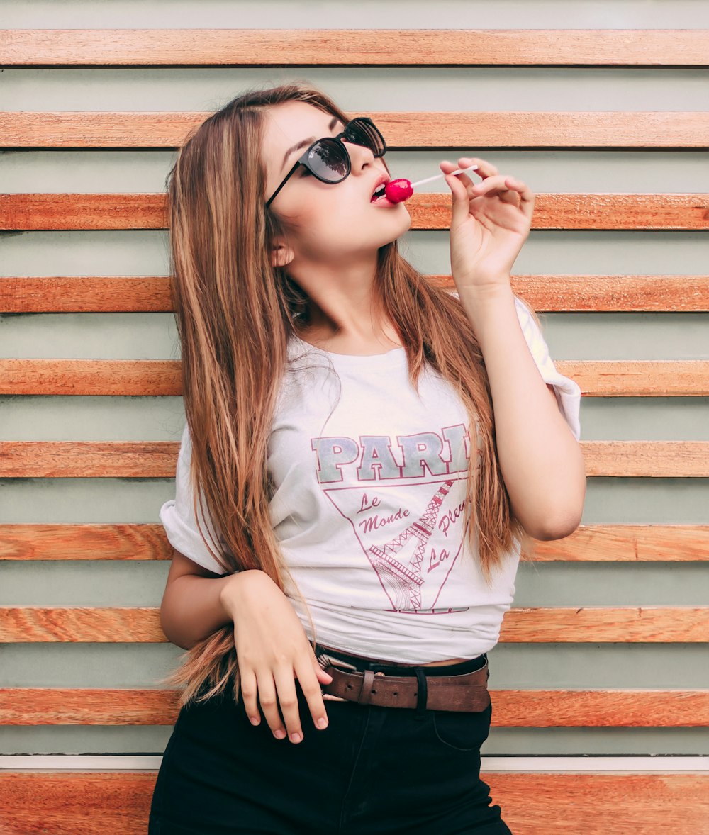 woman eating lollipop