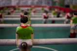 Close-up of animated football figurines battling on a vibrant green field