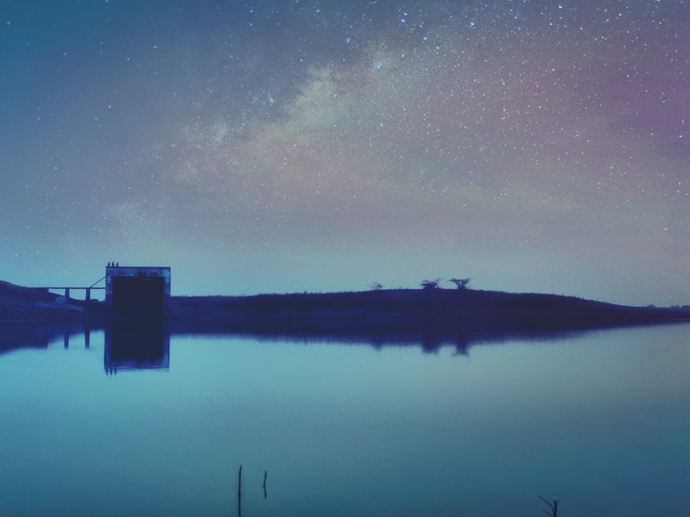 silhouette of dock under starry sky wallpaper