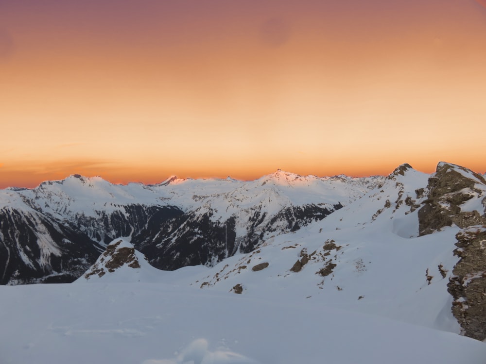 mountains with white snow during daytime