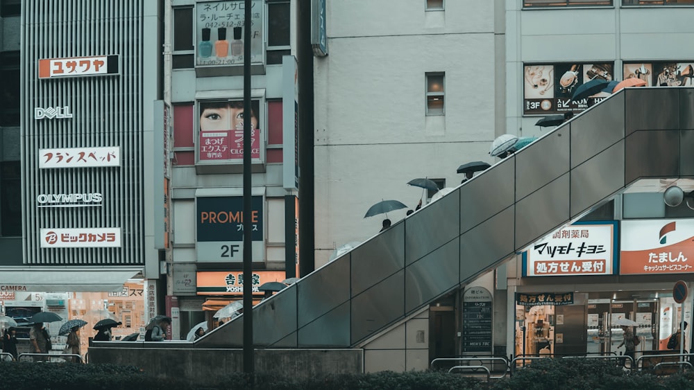 people on overpass near buildings