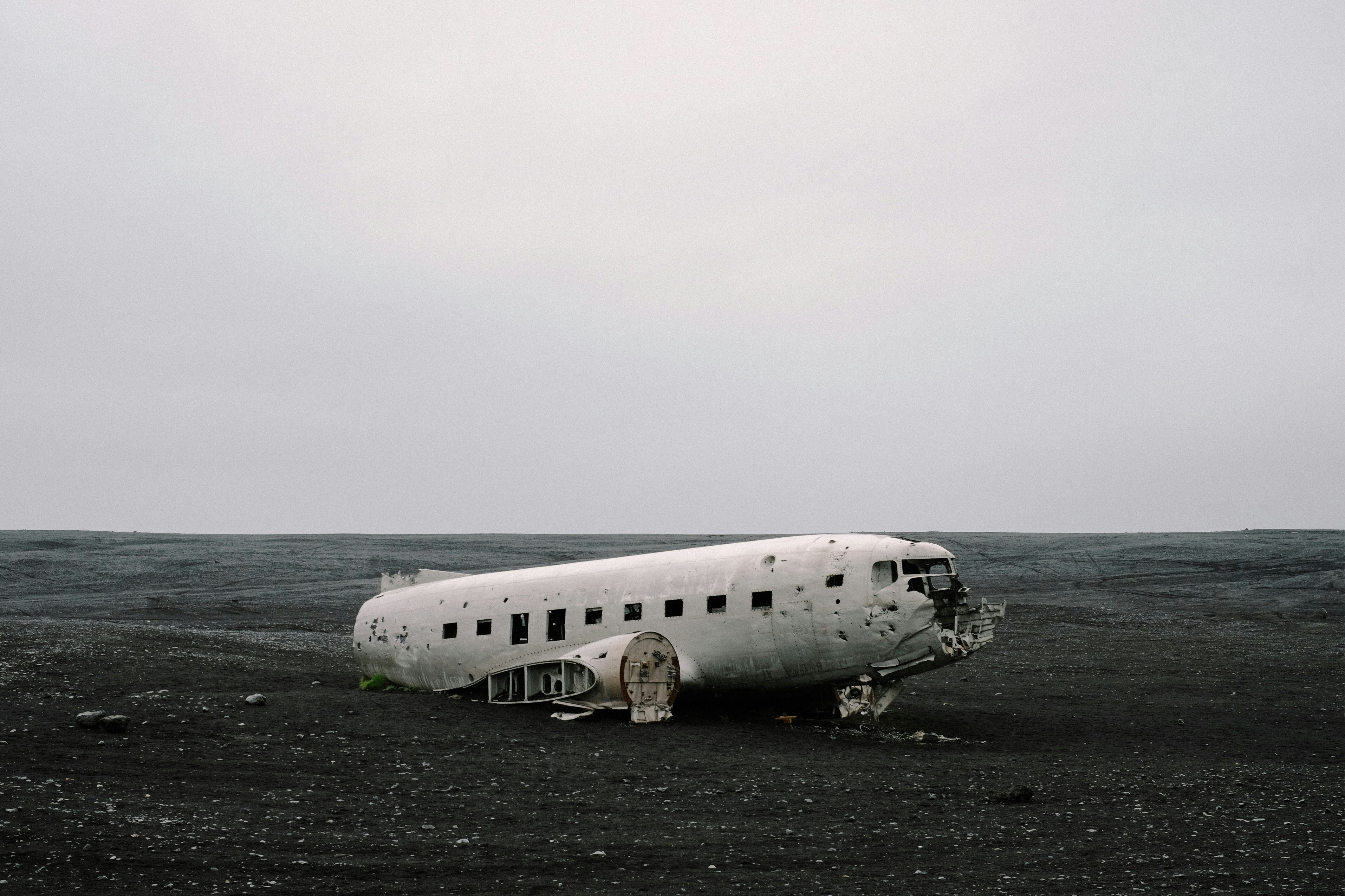 wrecked air plane on gray sand, Plane on Black Sand Beach