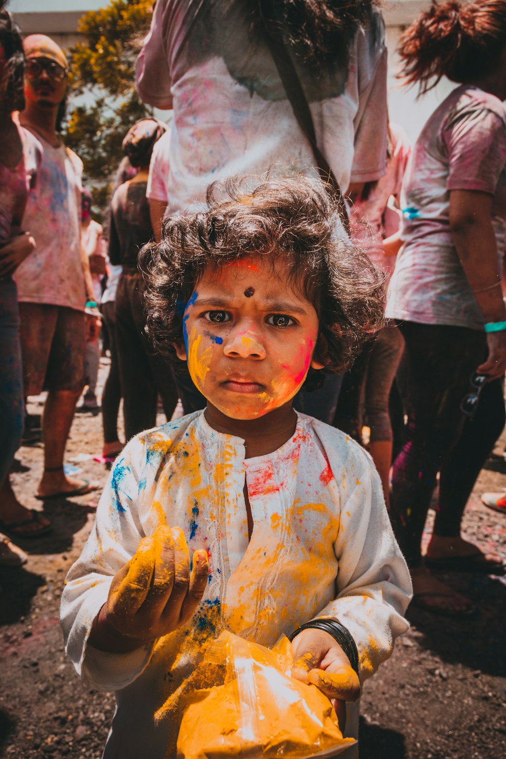 girl standing in front of group of people during daytime