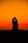 silhouette of man and woman during sunset