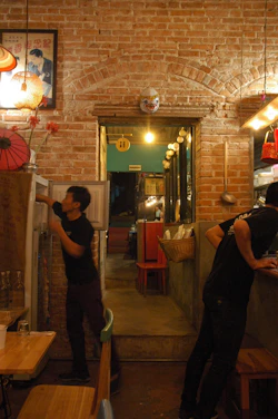 Cozy Scandinavian-style restaurant scene with vibrant dishes and team planning content in the background.