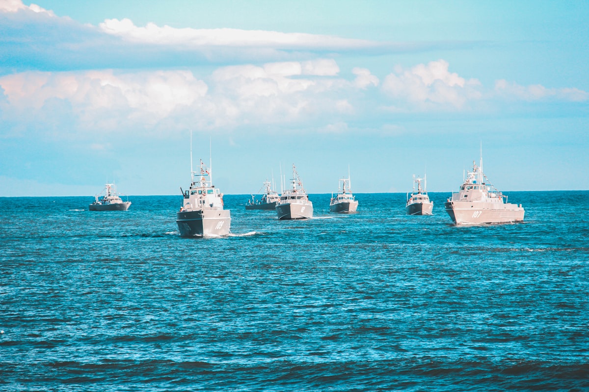 Navy warships sailing in formation on the open ocean