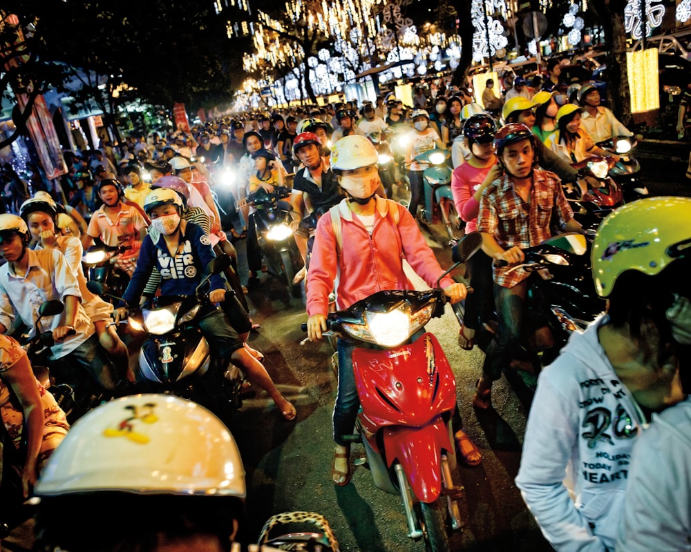 group of people riding a motorcycle
