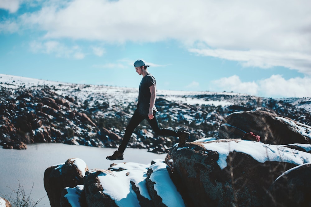 man walking on the rocks