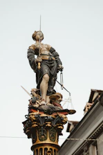 Statue of the blindfolded Roman goddess of justice holding scales, symbolizing fairness.
