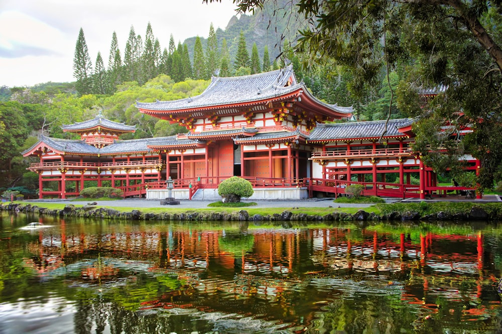 red and brow temple by water