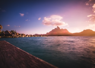 huts neat water and mountain