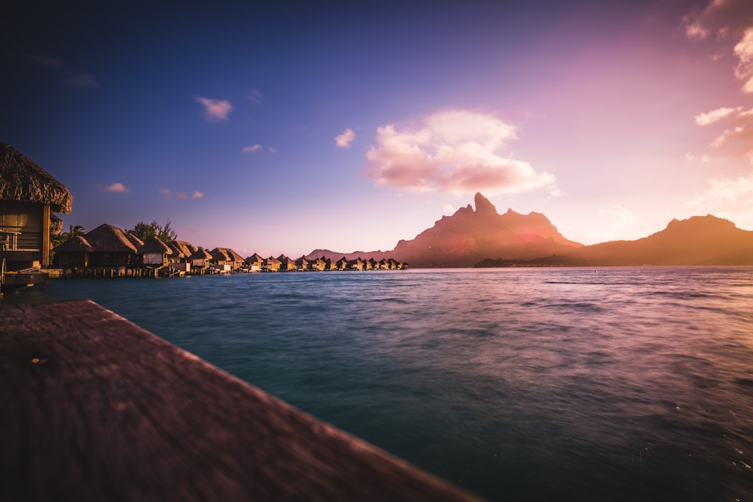 huts neat water and mountain,