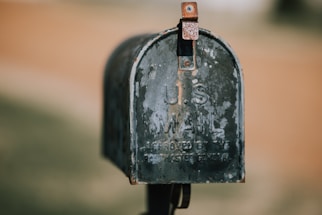 closeup photography of black U.S. mailbox
