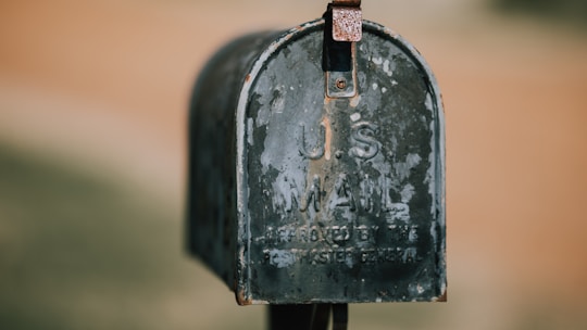 closeup photography of black U.S. mailbox