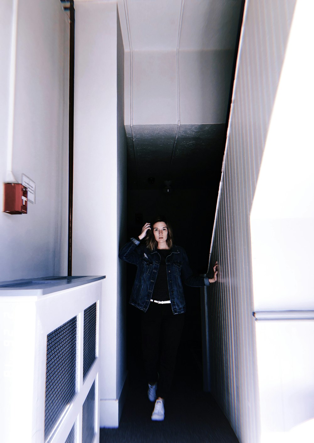 woman standing beside stairs