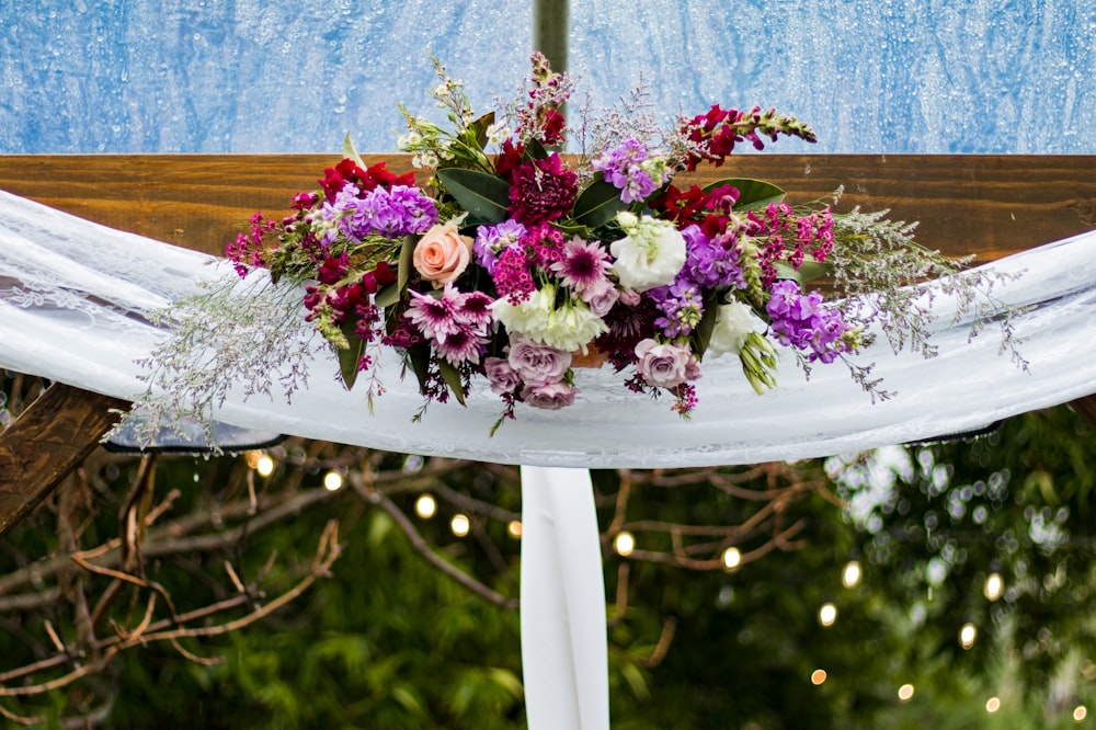 white, pink, and red petaled flowers decor