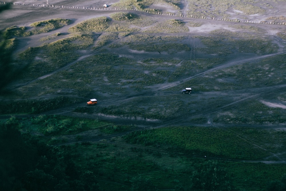 aerial photography of two vehicles moving on road