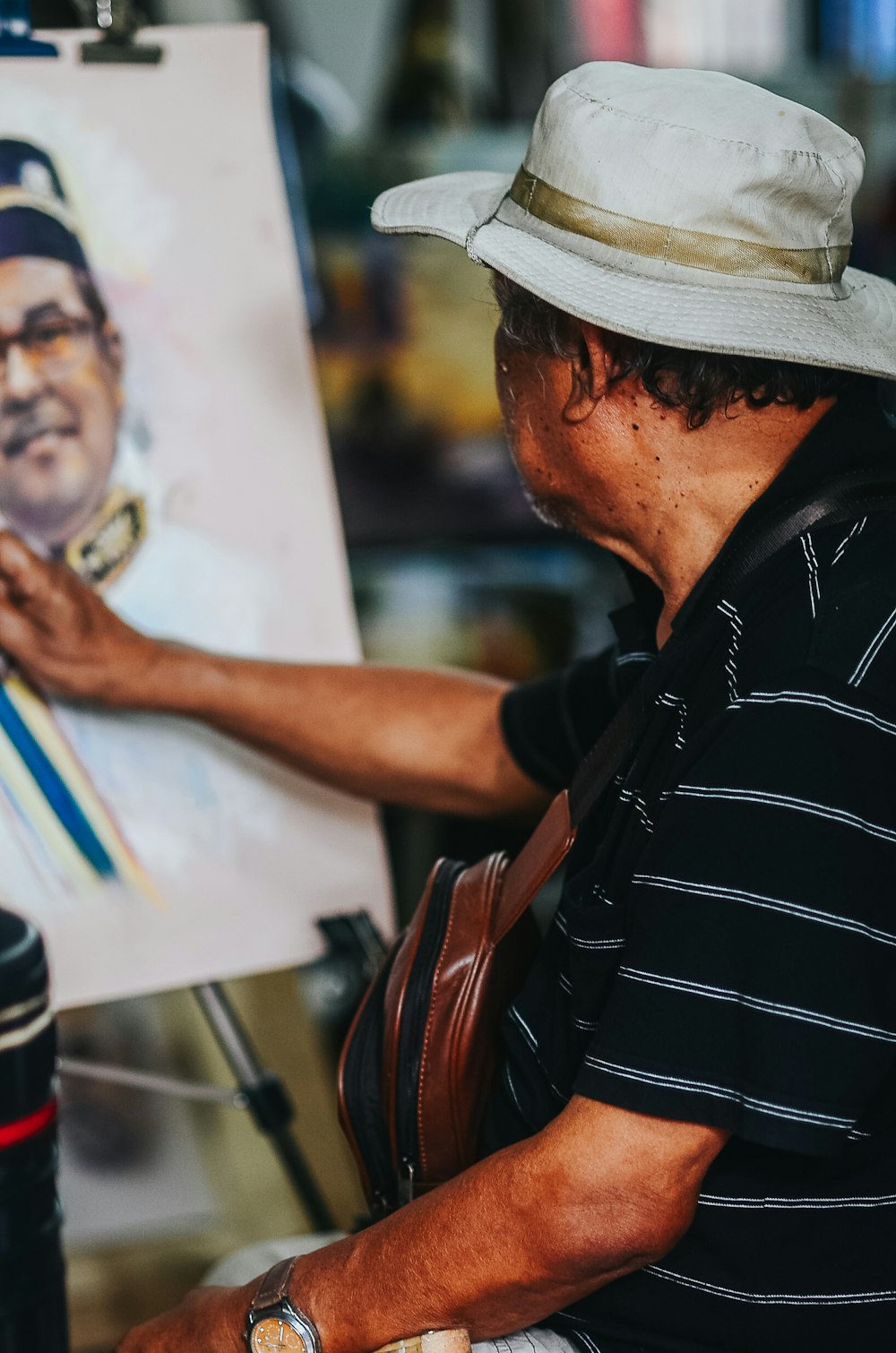 man painting portrait