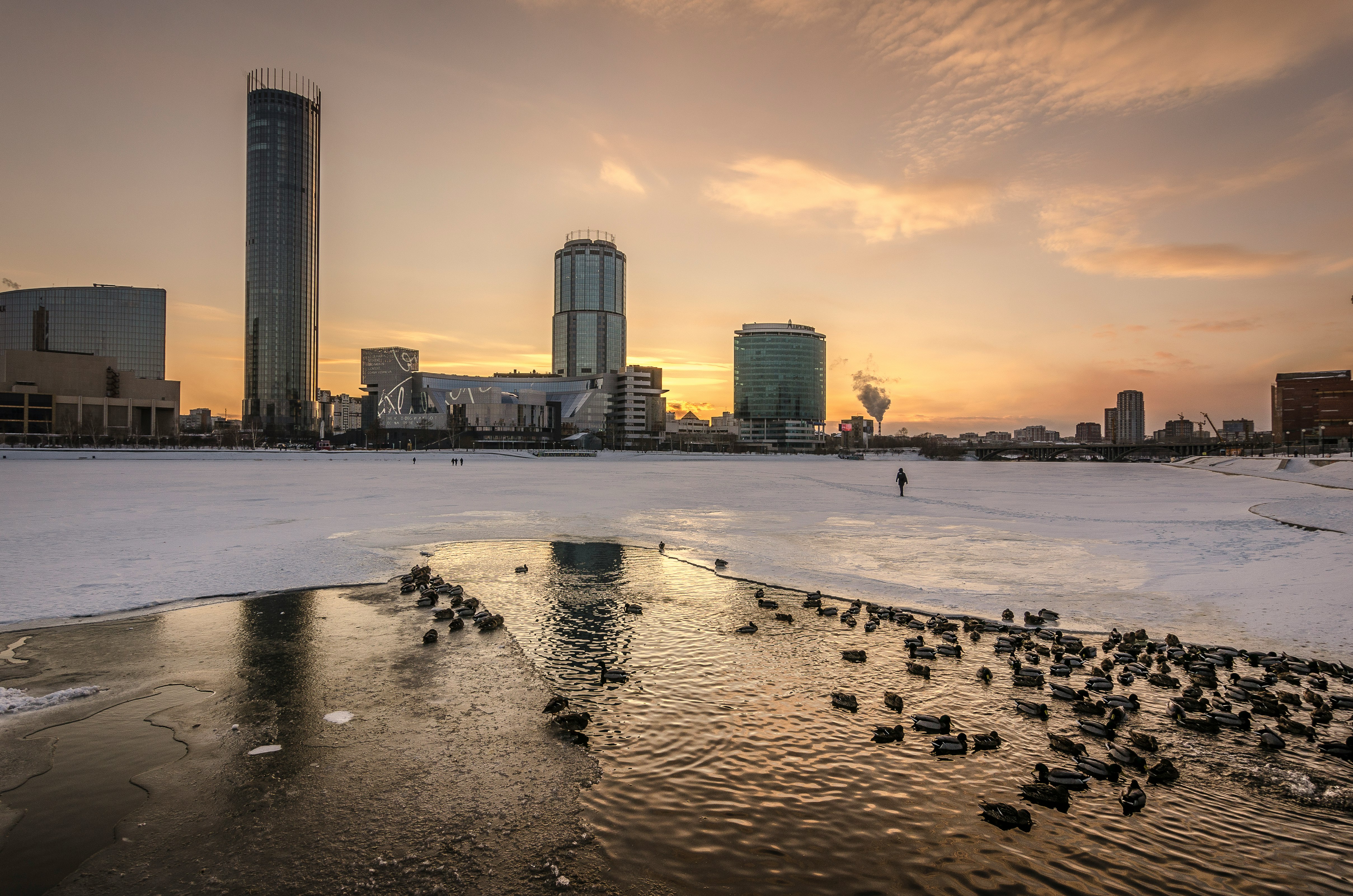 frozen lake beside city