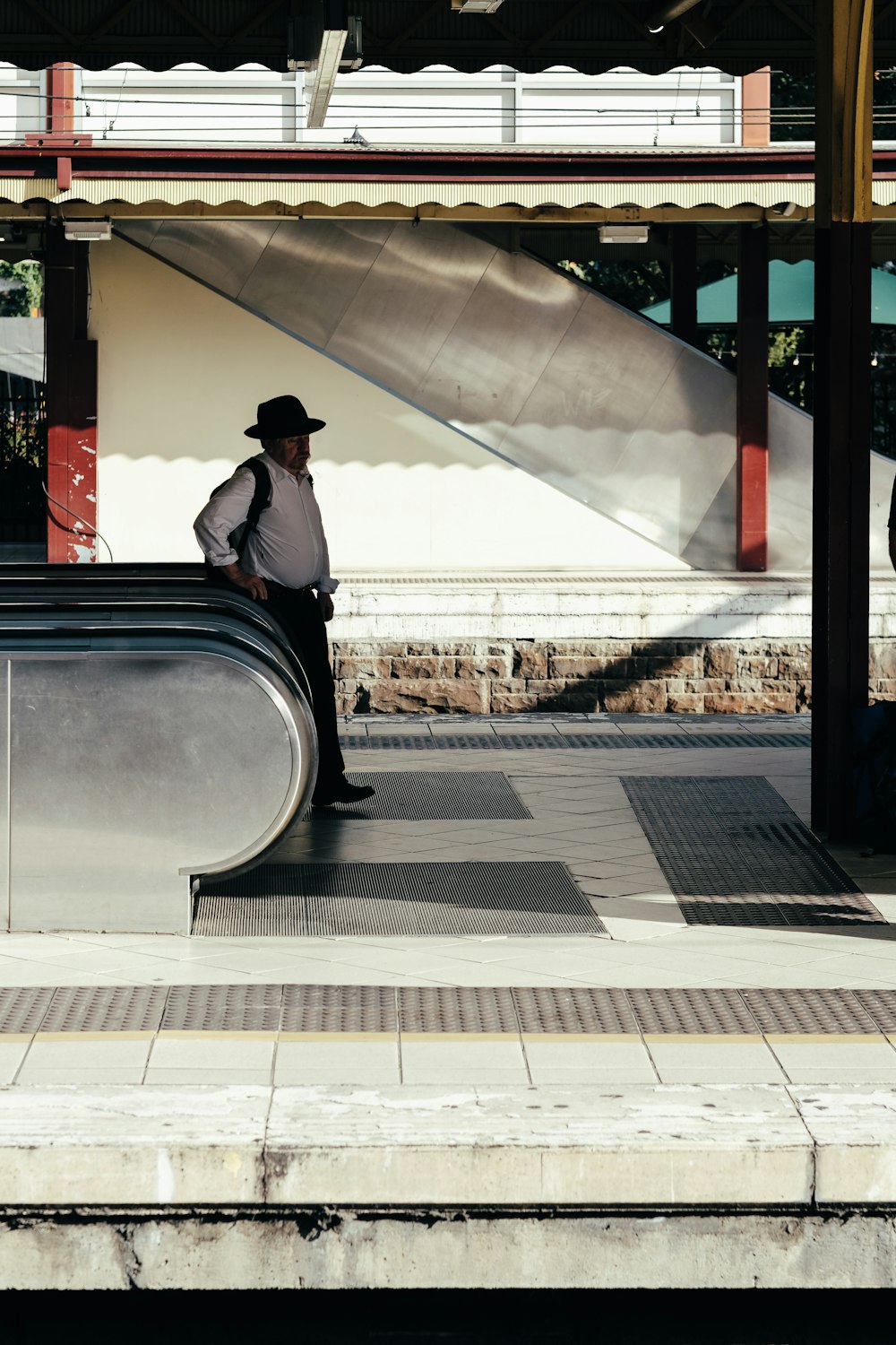 man beside escalator