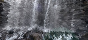 A digitally altered image creates a dynamic, pixelated effect resembling an abstract waterfall with cascading shapes and shades. The presentation is visually striking, turning an otherwise photographic scene into an intriguing piece of digital artwork.