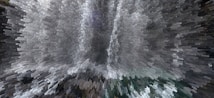 A digitally altered image creates a dynamic, pixelated effect resembling an abstract waterfall with cascading shapes and shades. The presentation is visually striking, turning an otherwise photographic scene into an intriguing piece of digital artwork.