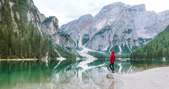 person standing on rock in Banff National Park, California in Parco naturale di Fanes-Sennes-Braies Italy