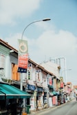 A vibrant street view of Vianópolis with the Dandara Store sign visible among local shops.