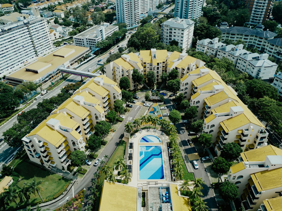 aerial photography of yellow-and-white concrete buildings at daytime