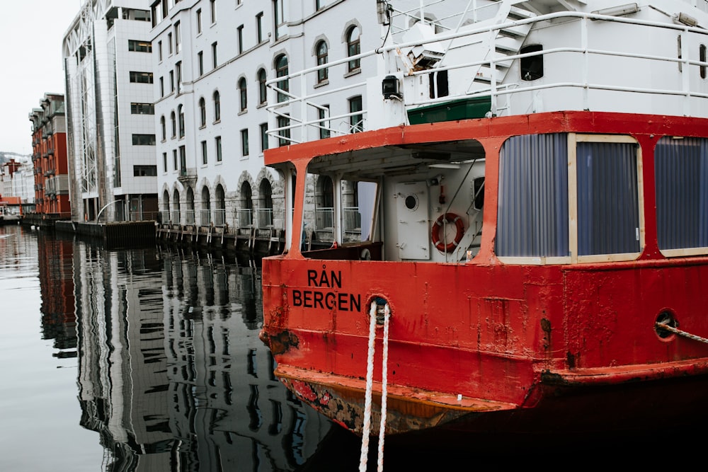 red boat near white building