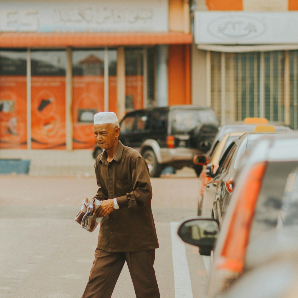 man holding news paper on street