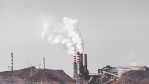 smoke comes out from industrial factory chimney