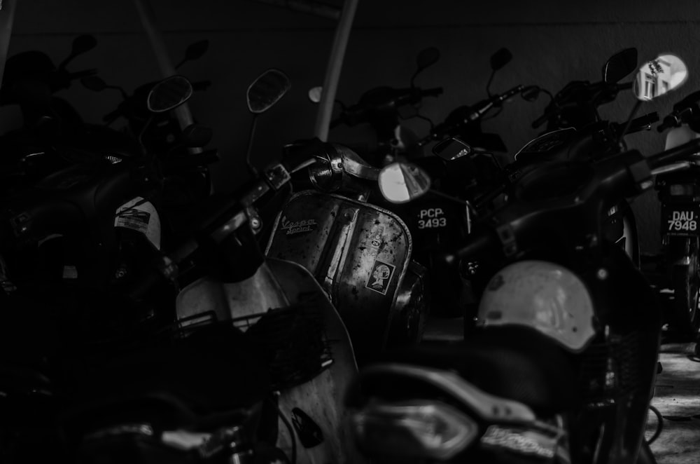 grayscale photography of motor scooters