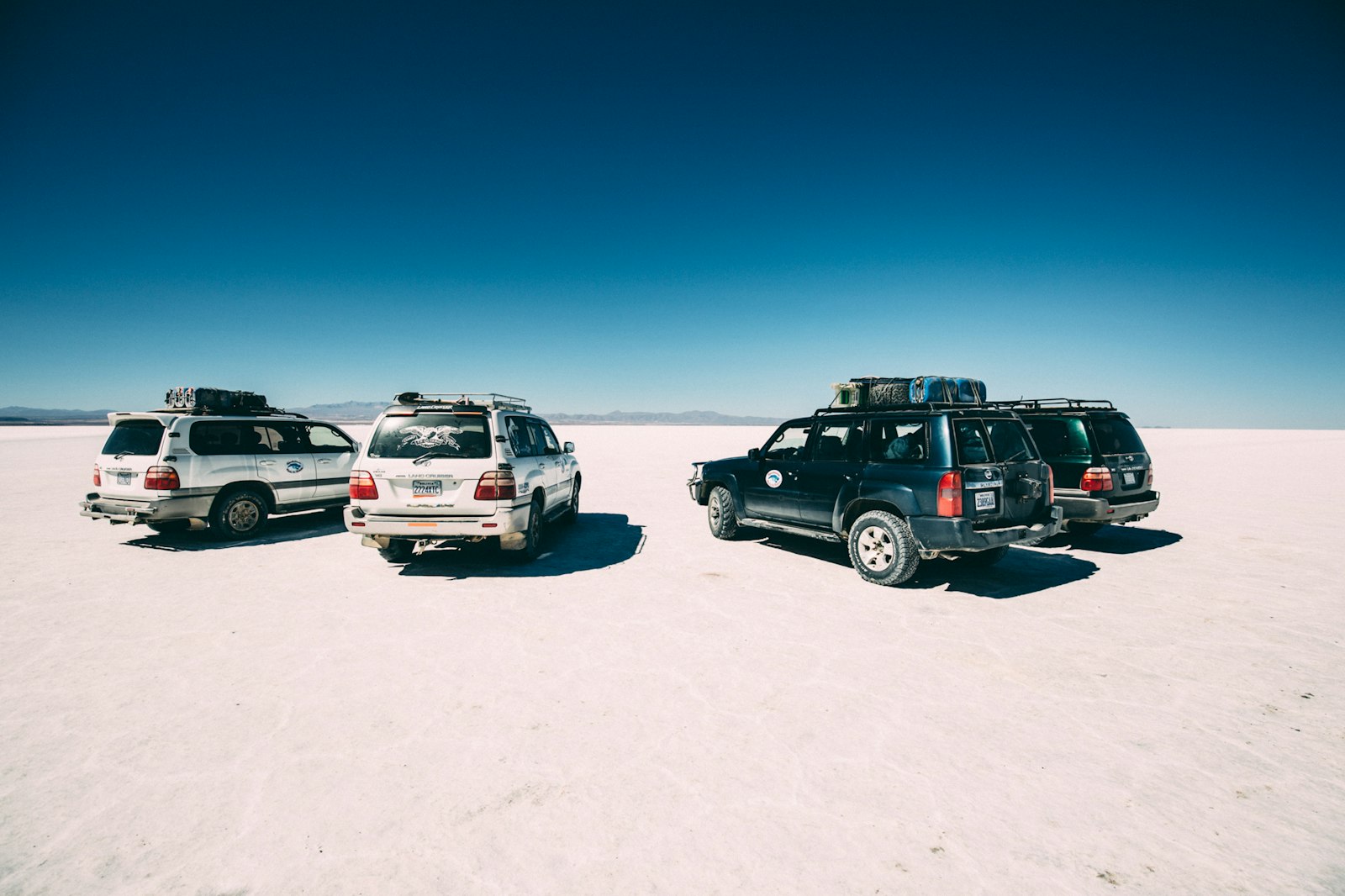 Canon EOS 5D Mark III + Canon EF 16-35mm F4L IS USM sample photo. Four vehicles on desert photography