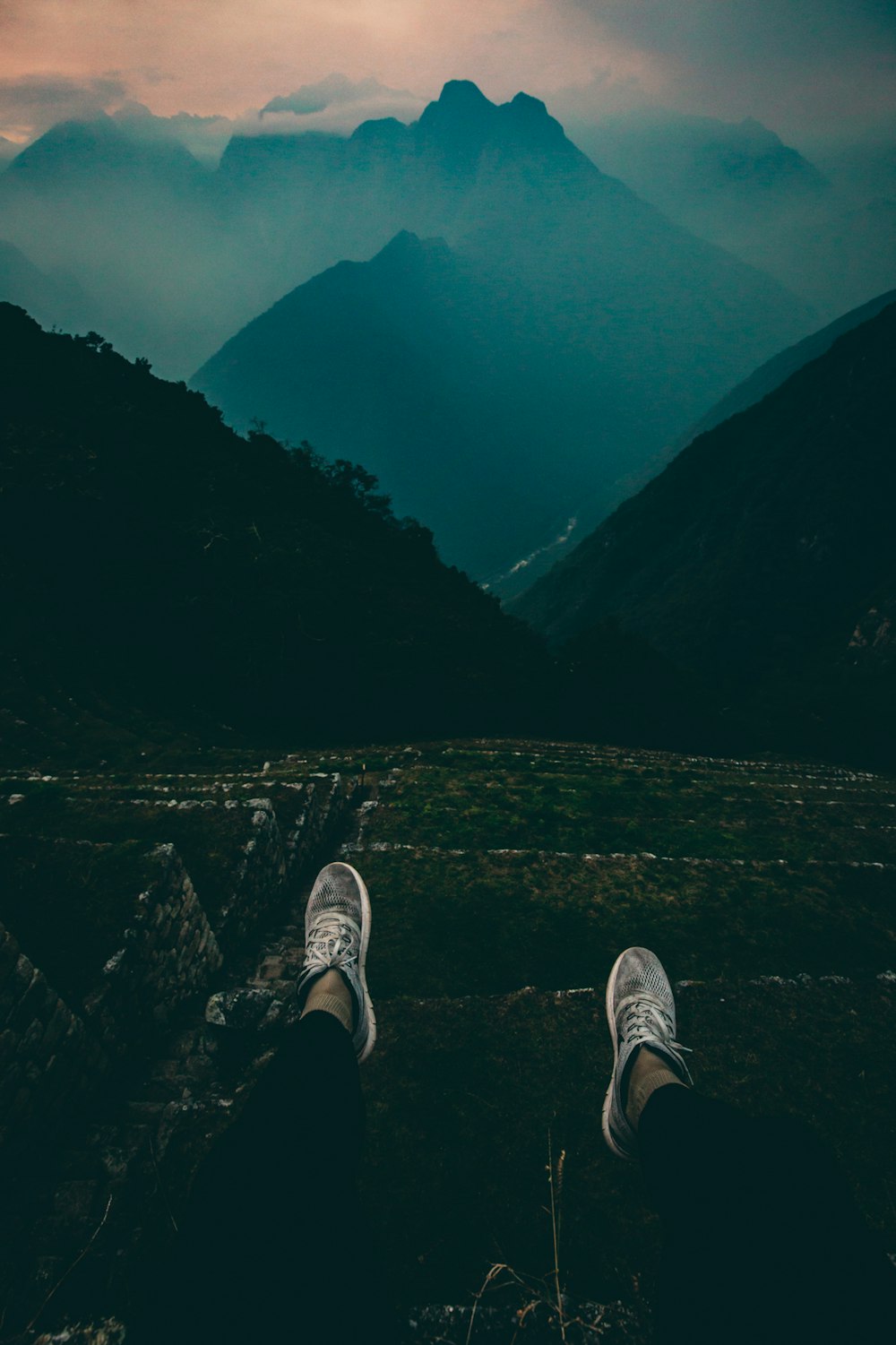 person standing on mountain peak