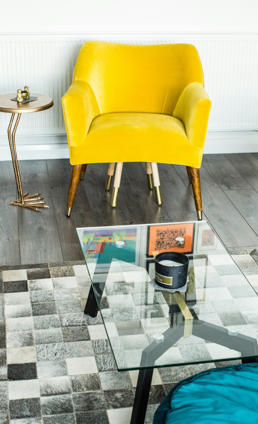 yellow suede armchair beside side table