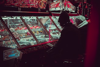 person playing on arcade machine
