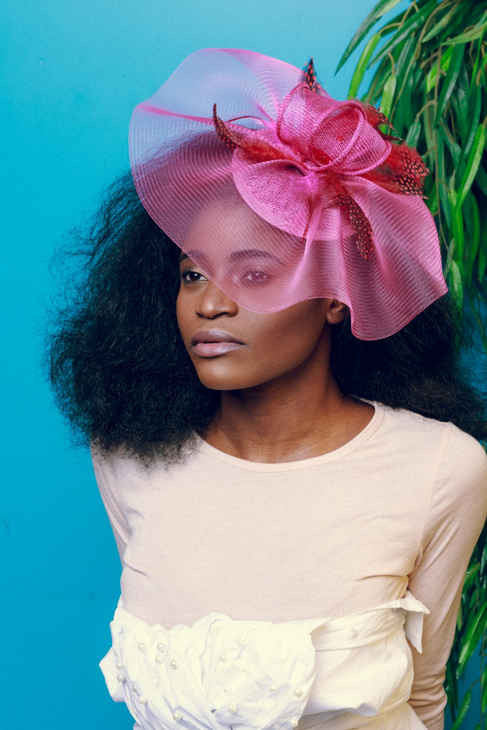 woman wearing fascinator hat