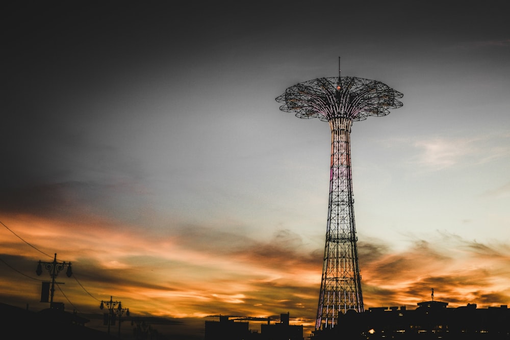 silhouette photography of tower during golden hour