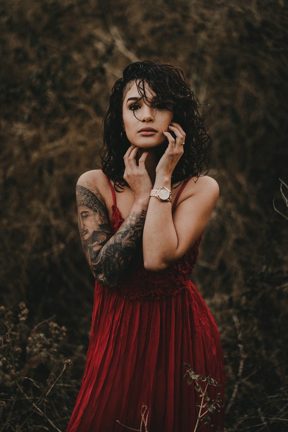 woman standing in the middle of grasses