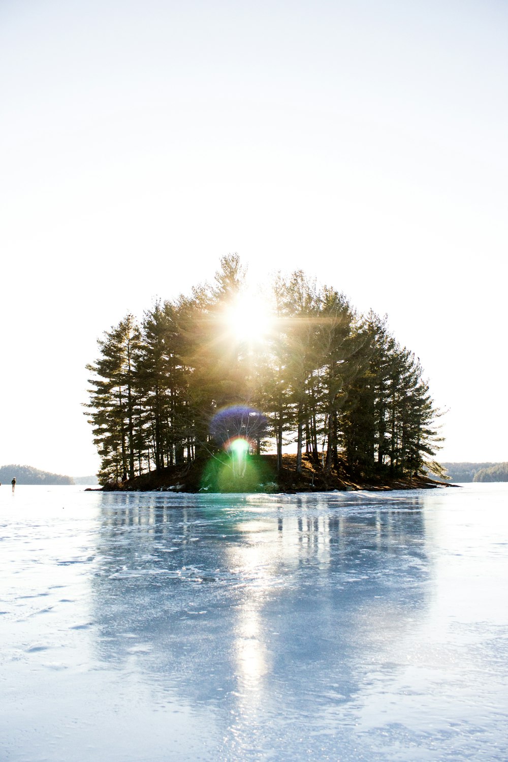 island with sun ray during daytime