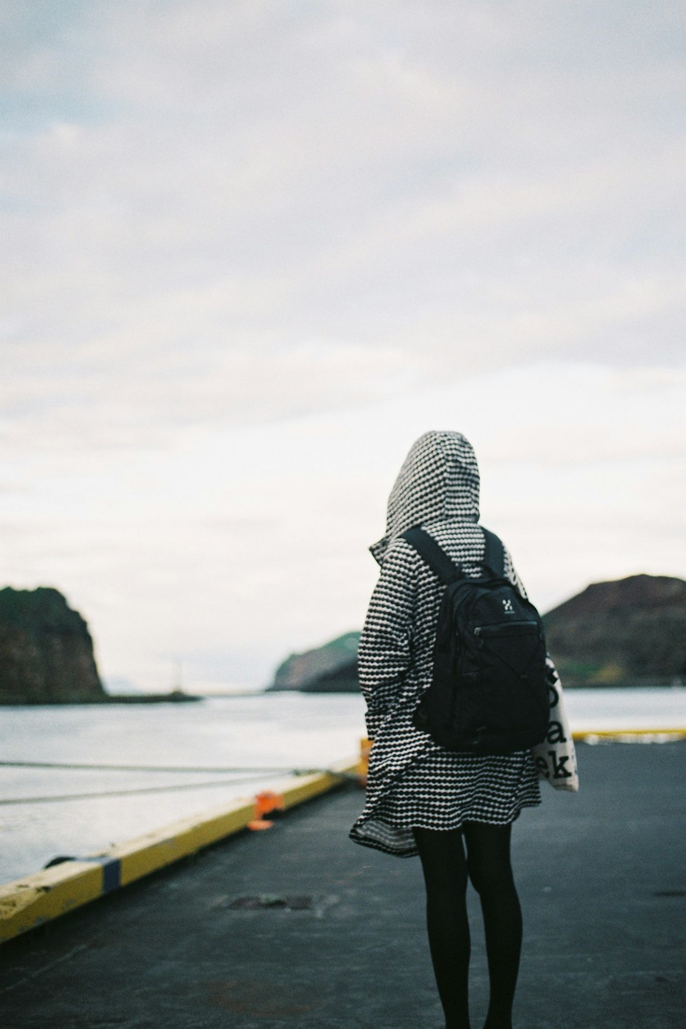 person standing on road