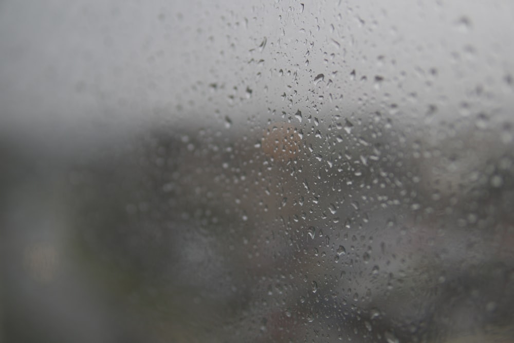 rain drops on a window with a blurry background