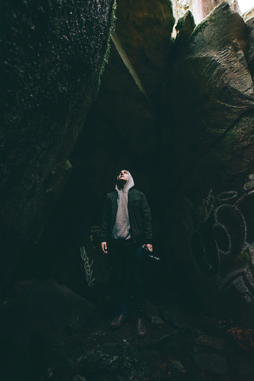 man standing in cave