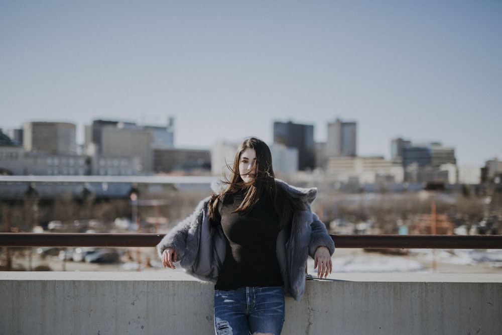 woman leaning on rail