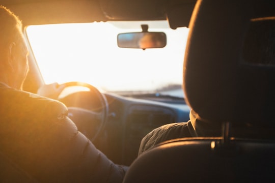 man driving car during golden hour in Udine Italy