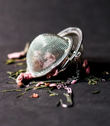 selective focus photography of round silver-colored accessory