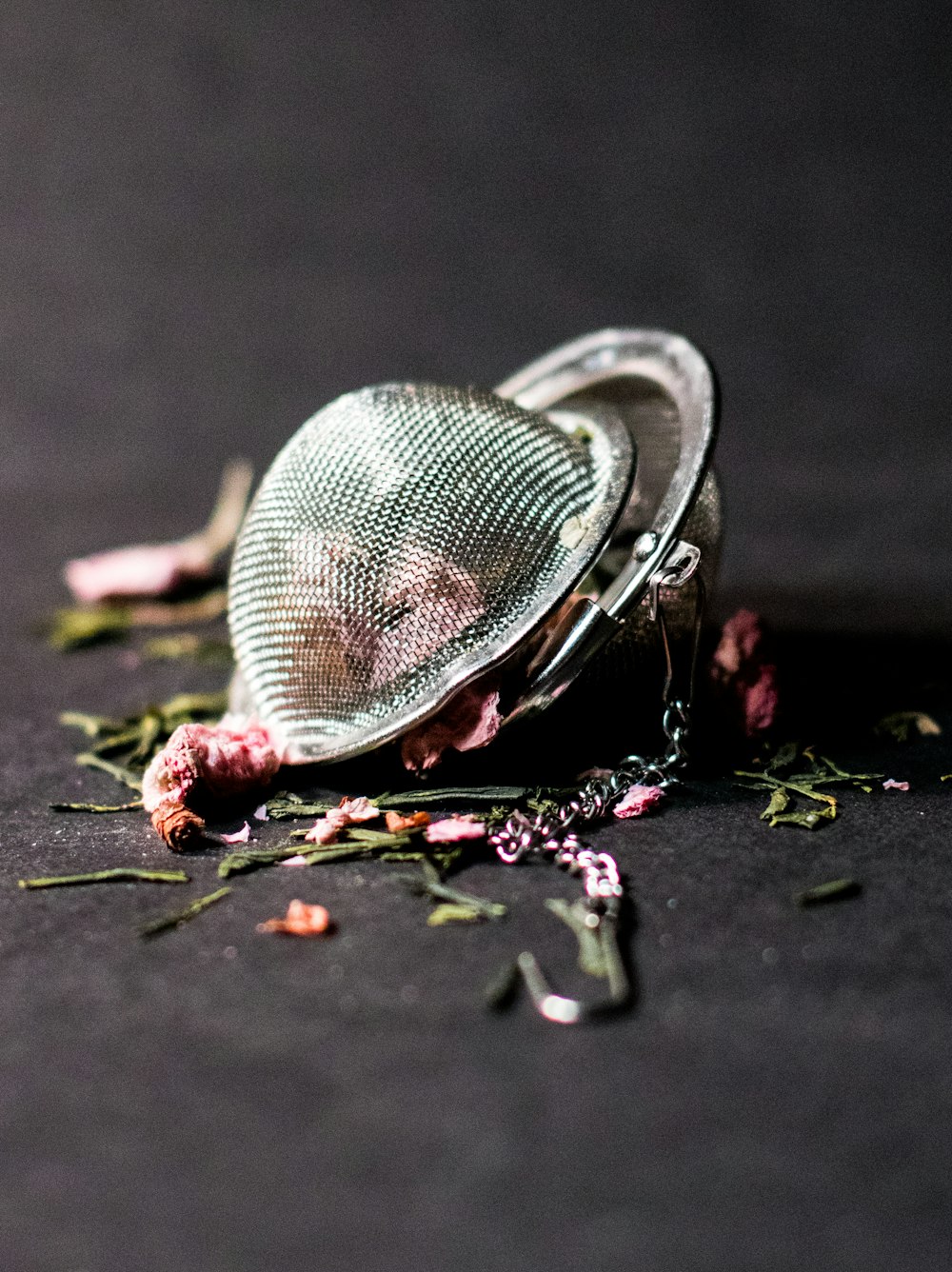 selective focus photography of round silver-colored accessory