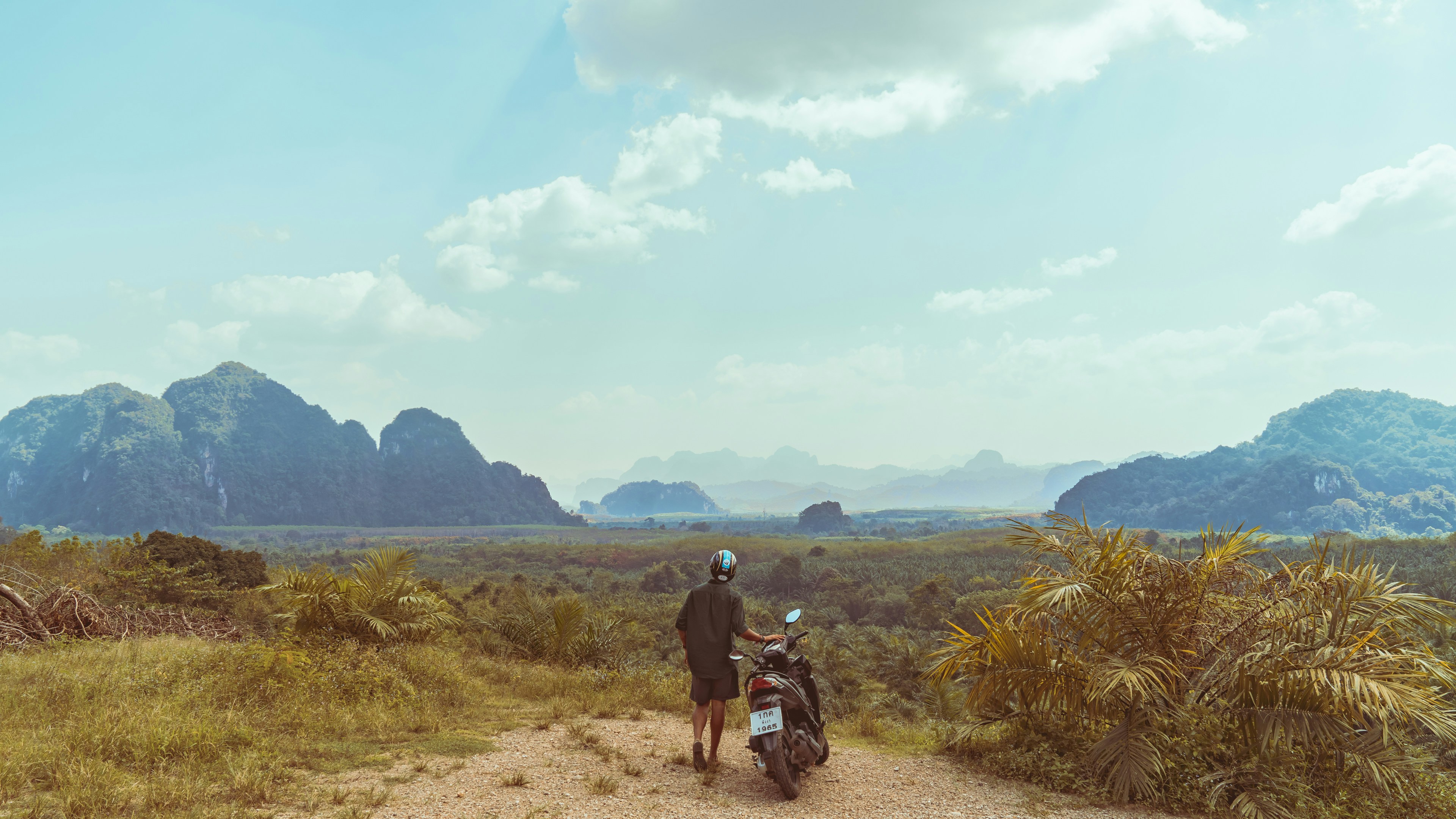 man standing on top of mountain, Green & Blue