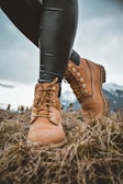 man wearing boots standing on ground